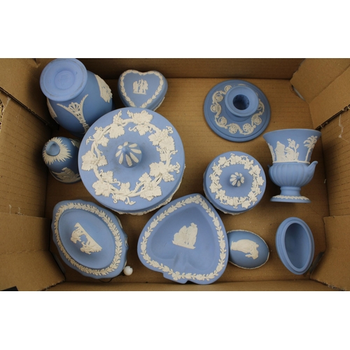 311 - A collection of Wedgwood Jasperware items to include vases, pin trays, heart shape box, candle stick... 