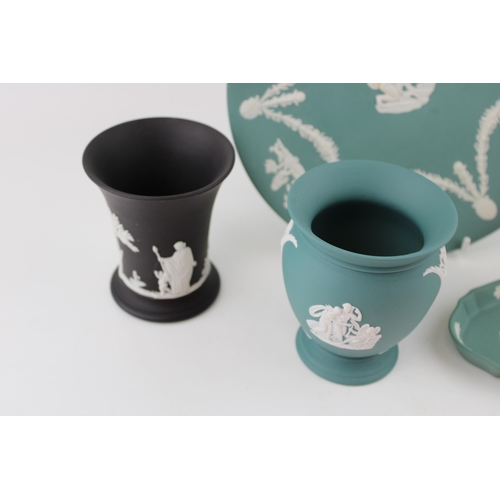 317 - A collection of Wedgwood Jasperware items in Teal and Black colours to include pair of vases, pin tr... 