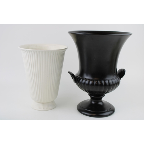 332 - Wedgwood white ribbed vase, probably Norman Wilson, with a large black gloss urn, 25cm tall (2).