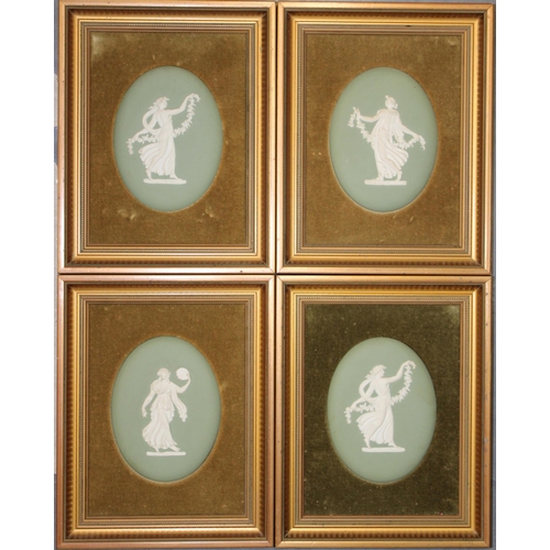 345 - Four Wedgwood Japserware oval plaques of muses in sage green. Impressed mark to reverse, in gilt fra... 