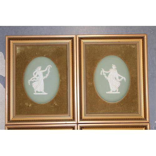 345 - Four Wedgwood Japserware oval plaques of muses in sage green. Impressed mark to reverse, in gilt fra... 