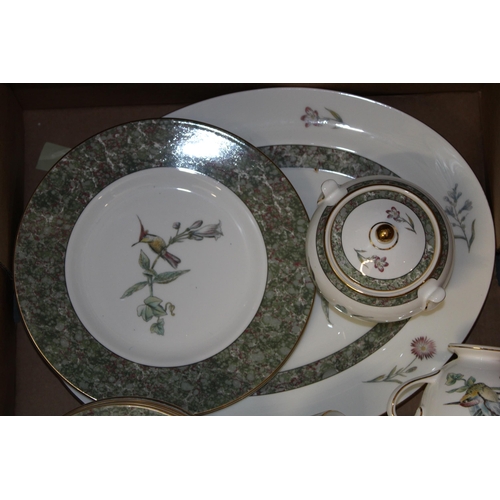 348 - Wedgwood teaware in the Humming Birds pattern to include a teapot, a large platter, 6 trios, a mug, ... 