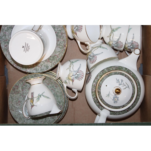 348 - Wedgwood teaware in the Humming Birds pattern to include a teapot, a large platter, 6 trios, a mug, ... 