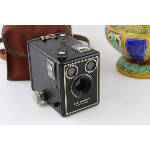 353 - A Majolica style jug together with a Box Brownie camera. Height 27cm. (2)