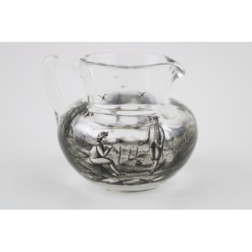 364 - Early 19th century small glass jug, painted black decoration of romantical boating scenes, 9cm wide.