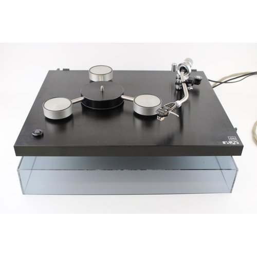 Rega 'Planet' turntable with Acos Lustre tonearm. Designed in 1972 and  produced by Rega Research Ltd, UK
Black laminated plinth with three spoke steel and aluminium platter. Polished brushed steel and aluminium tonearm with original headshell. Acrylic hinged removable lid. Width 44.5cm, Depth 36cm, Height 12cm.