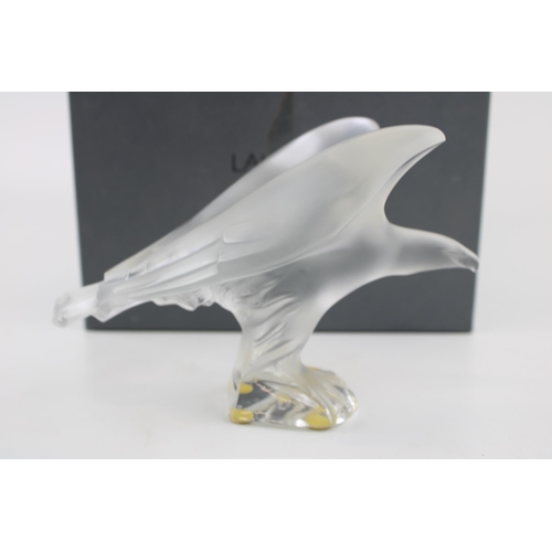 378 - A Lalique frosted sculpture of an eagle perched on a clear base. Lalique sticker on the base, and La... 