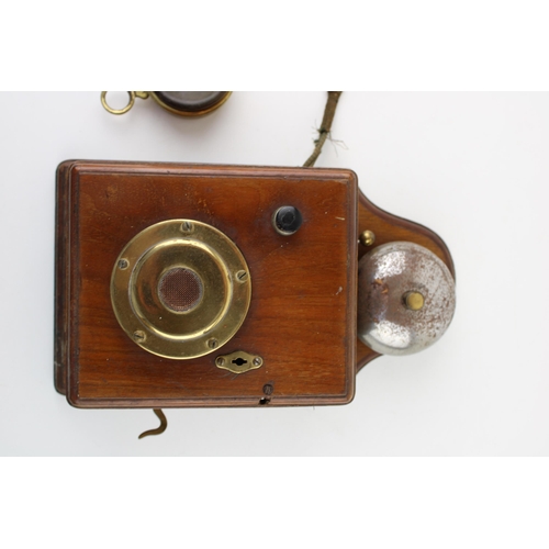 385 - An early c20th vintage wooden mahogany wall or signal box telephone with serial number 028515