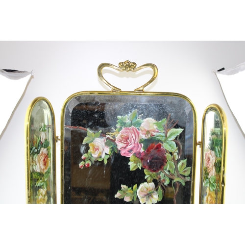 390 - An Edwardian Art Nouveau style brass mirrored and hand painted fire screen