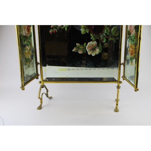 390 - An Edwardian Art Nouveau style brass mirrored and hand painted fire screen