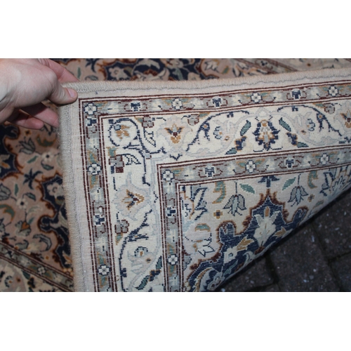 394 - A Persian style runner / rug carpet in blues and creams. Dimensions 182cm x 80cm.