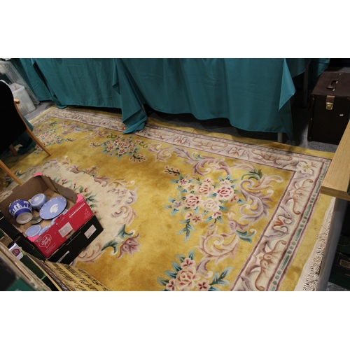 395 - A large Chinese wool carpet in yellow with cream with turquoise. Dimensions 282cm x 255cm.