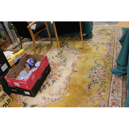 395 - A large Chinese wool carpet in yellow with cream with turquoise. Dimensions 282cm x 255cm.