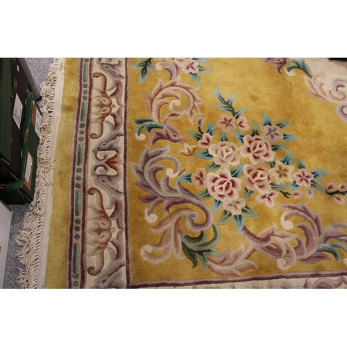 395 - A large Chinese wool carpet in yellow with cream with turquoise. Dimensions 282cm x 255cm.