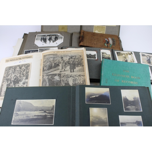 412 - A collection of early c20th photographs and postcards in ten albums with military, scouting, family ... 