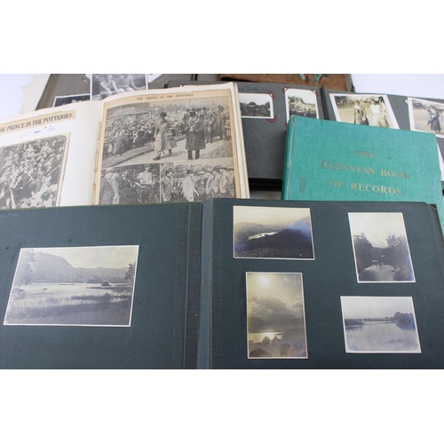 412 - A collection of early c20th photographs and postcards in ten albums with military, scouting, family ... 