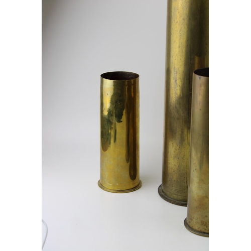 433 - A collection of six WW1 German brass shell casings of various sizes and calibres dated 1916, 1917 an... 