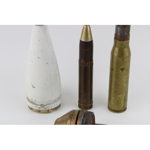 434 - A collection of WW1 and later ordnance relics to include German Dopp Fuse two trench art bullet case... 