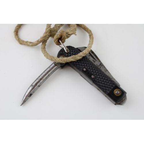 450 - A 1952 dated Army clasp pocket knife by Colin Winand with blade, can opener and marlin spike with la... 