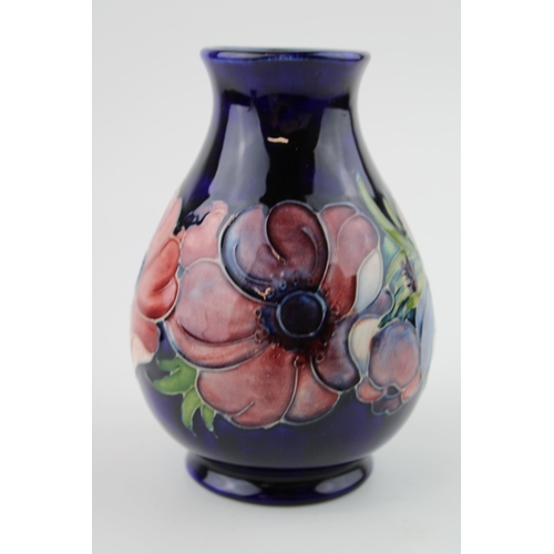 46 - Moorcroft Hibiscus on blue background vase, 13.5cm tall.