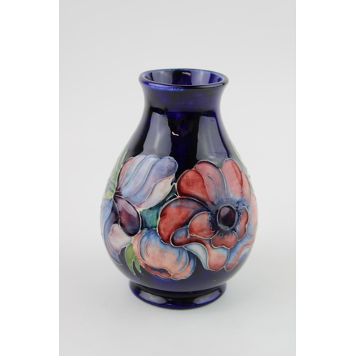 46 - Moorcroft Hibiscus on blue background vase, 13.5cm tall.