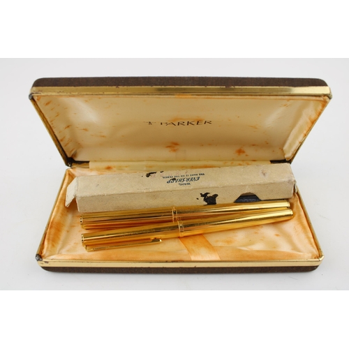 469 - A Parker gold plated fountain pen with gold nib and a gold plated Parker rollerball pen & a gold fil... 