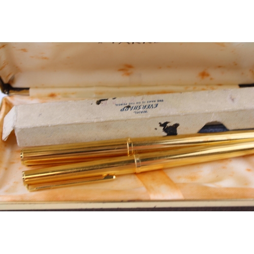 469 - A Parker gold plated fountain pen with gold nib and a gold plated Parker rollerball pen & a gold fil... 