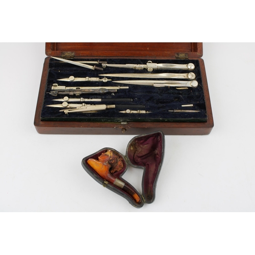 470 - A c19th Victorian Draughtsman's drawing set and rulers with a cased meerschaum pipe shaped as a lady... 