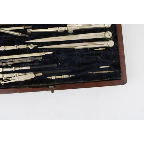 470 - A c19th Victorian Draughtsman's drawing set and rulers with a cased meerschaum pipe shaped as a lady... 