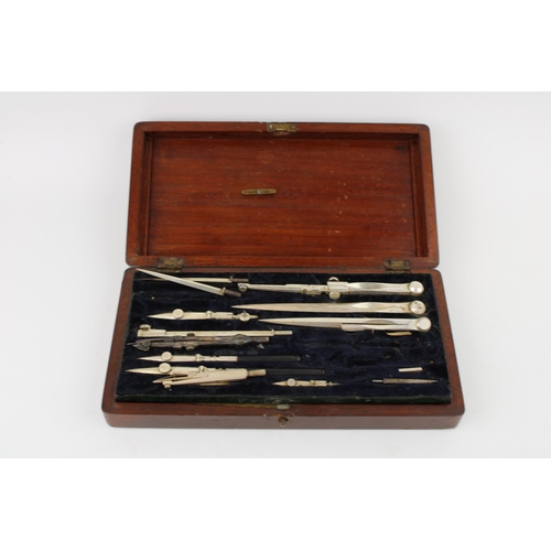 470 - A c19th Victorian Draughtsman's drawing set and rulers with a cased meerschaum pipe shaped as a lady... 