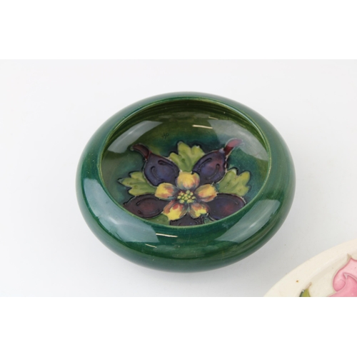 48 - A Moorcroft bowl in the 'Clematis’ pattern together with an ashtray in the 'Magnolia' pattern. (2)