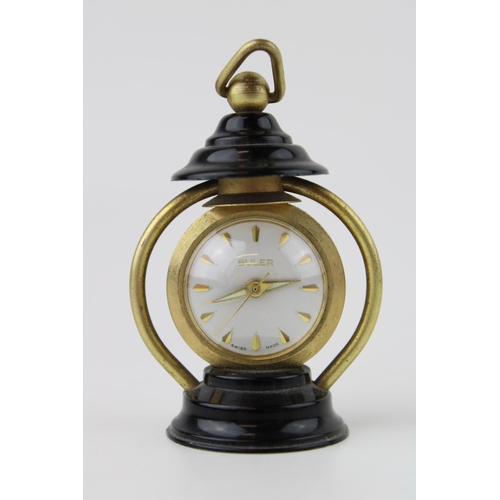 487 - A 'Buler' manual winding miniature lantern clock. Swiss movement with glass back. Height 7cm.