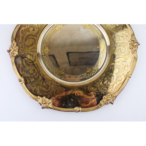 506 - A De Lamerie silver-plated plate with gilt decoration. Marked De Lamerie England. Diameter 37cm.