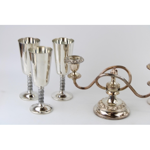 511 - A set of six silver plated goblets with floral engraved wrythen stems by Angulo of Spain, together w... 