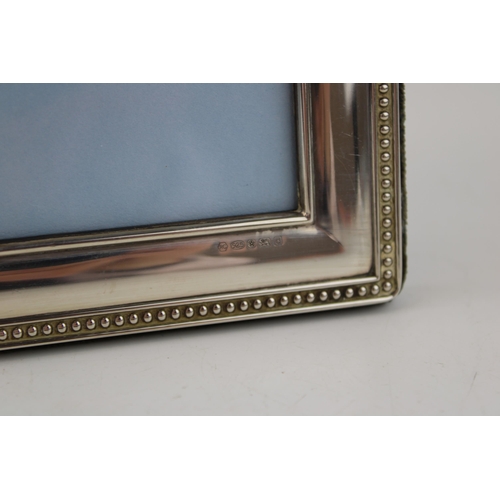 518 - A silver photo frame hallmarked Sheffield 2003. For photo size 13cm x 9cm (5