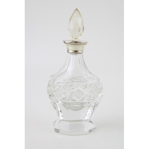 521 - Silver ornate perfume bottle, London 1929, Wolfski & Co, 14cm tall, with stopper.