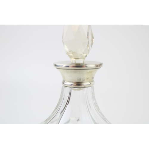 521 - Silver ornate perfume bottle, London 1929, Wolfski & Co, 14cm tall, with stopper.