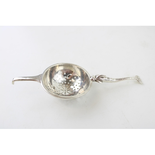 534 - Silver 'Traptrain'  tea strainer, Edinburgh 1934, Broome & Son, 32.9g.