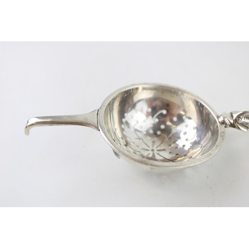 534 - Silver 'Traptrain'  tea strainer, Edinburgh 1934, Broome & Son, 32.9g.