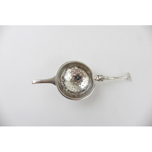 534 - Silver 'Traptrain'  tea strainer, Edinburgh 1934, Broome & Son, 32.9g.