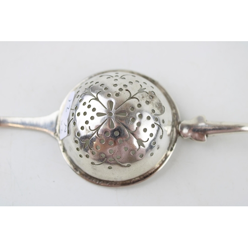 534 - Silver 'Traptrain'  tea strainer, Edinburgh 1934, Broome & Son, 32.9g.