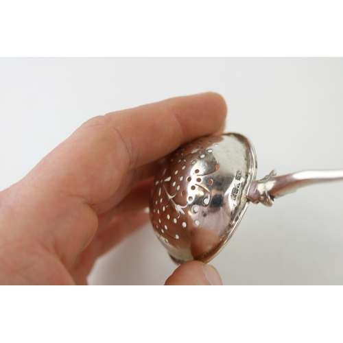 534 - Silver 'Traptrain'  tea strainer, Edinburgh 1934, Broome & Son, 32.9g.