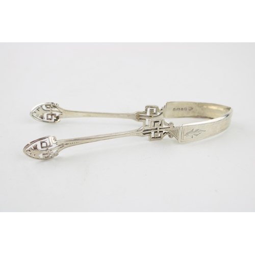 536 - Silver ornate tongs, Sheffield 1876, J Rhodes, 32.7g, 14cm long.