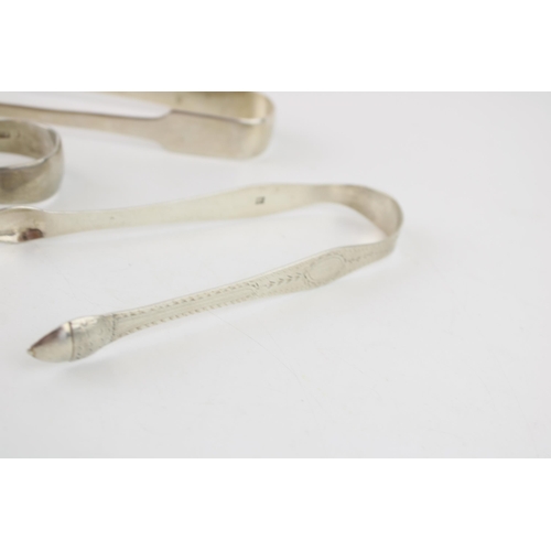 538 - Three pairs of silver tongs to include a pair of Georgian bright cut tongs, London, circa 1795, P & ... 