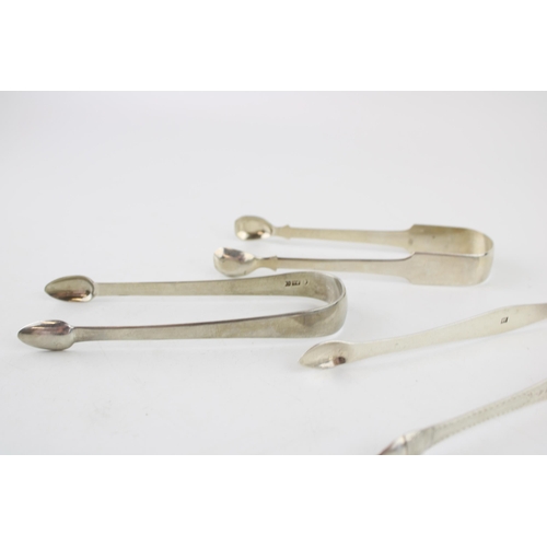 538 - Three pairs of silver tongs to include a pair of Georgian bright cut tongs, London, circa 1795, P & ... 