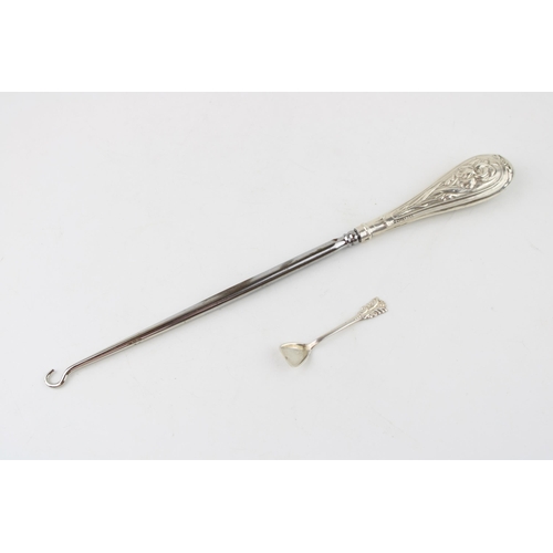 539 - A large silver handled button hook, Birmingham 1906, H Matthews, with a sterling silver condiment sp... 