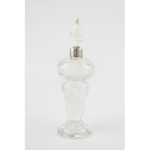 551 - Silver and glass perfume bottle, etched floral decoration, with stopper, 16cm tall.