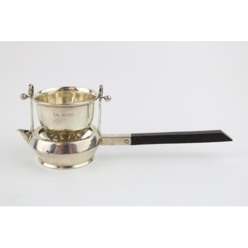 552 - Silver novelty tea strainer, ebonised wooden handle, Birmingham 1916, Walker & Hall, 16.5cm long.