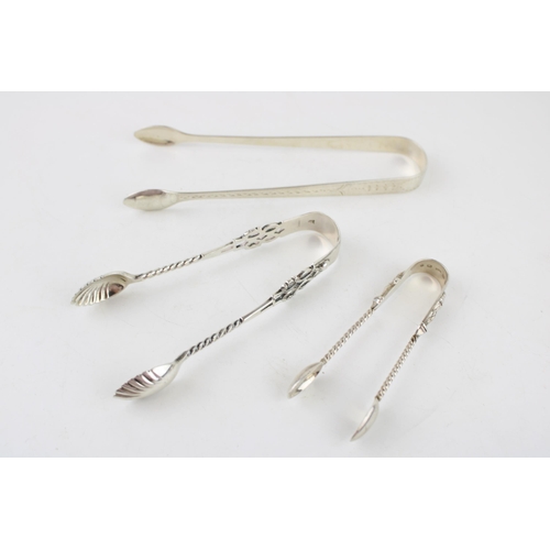 555 - Three pairs of silver sugar tongs to include Birmingham 1888 G Unite, Georgian bright cut tongs, Lon... 