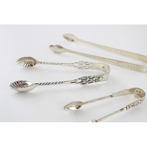 555 - Three pairs of silver sugar tongs to include Birmingham 1888 G Unite, Georgian bright cut tongs, Lon... 